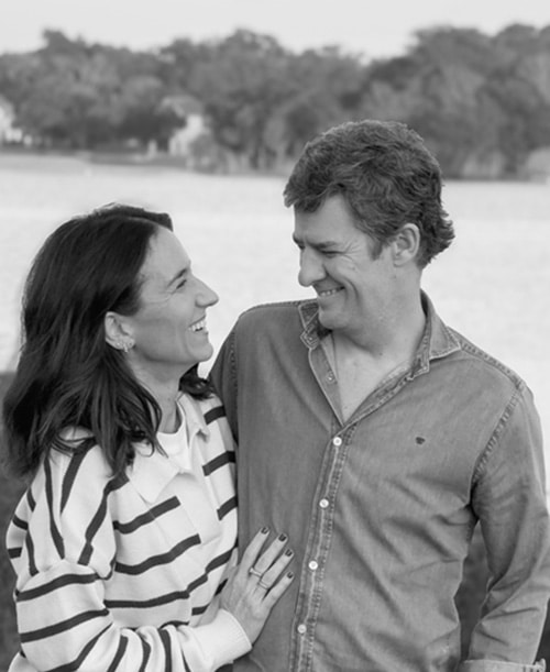 Maria and Fernando laughing and enjoying their visit to the beach