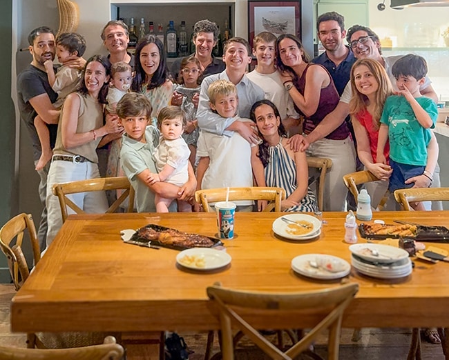 Hopeful adoptive couple with Maria's family after enjoying a meal together